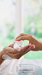 Hands, healthcare and pills with patient in hospital bed for hydration, recovery or treatment. Drink, medical care and supplements with senior person in clinic for assistance, help or wellness