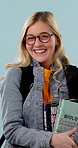 Face, woman and college student in studio with books, glasses or higher education science degree. Happy, person and learning with university textbook, spectacles or biology course on blue background.