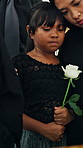 Girl, hug and mom in church for funeral, compassion or burial for death, support or crying with coffin. Child, embrace or sad kid in chapel for grief, loss or mourning with father and empathy
