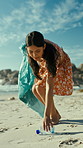 Woman, recycling and beach with plastic bottle for climate change, save planet or earth day. Female person, volunteer or cleaning with dirt bag for community service or outdoor hygiene on ocean coast