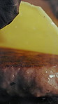 Hand, meat and chef with cheese burger for restaurant, cooking and fast food for lunch service. Takeaway, person and hamburger on grill in kitchen for meal prep, nutrition or frying beef for barbecue