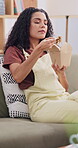 Fast food, eating and noodles with woman on sofa for chinese takeaway, nutrition and lunch. Chopsticks, happiness and hungry with person and order in living room in house for meal, cuisine and relax