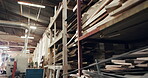 Carpentry, lumber and shelves in empty factory for craftsmanship, manufacturing or production. Creativity, inventory and timber with wood in warehouse interior for furniture business or storage