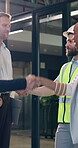 Engineering, handshake and team with people in office for architect contract, meeting and partnership. Thank you, welcome and contractor with employees shaking hands in agency for project agreement