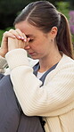 Sad, nurse and woman with anxiety at park, think and contemplating decision with burnout and regret. Outdoor, caregiver and person with depression, reflection and remembering bad memories or stress