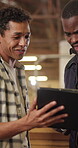 Carpenter, team and men with tablet in workshop, conversation and planning for furniture production. Warehouse, artisan and people with technology, manufacturing and woodworking project on website