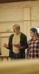 Carpenter, tablet and manager in factory for production, planning and supervisor guidance. Woodwork, people and talking with tech for training, feedback or walk with team for manufacturing inspection