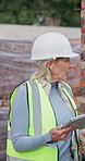 Tablet, team and discussion on construction site for engineer, inspection and property development. Tech, management and mature architect with people for maintenance, repairs or renovation safety