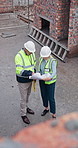 Above, people and document at site for construction, inspection and blueprint for architecture. Team, reading or paperwork at worksite for floor plan, upgrade and information for building development