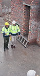 Above, people and walking at site for construction, inspection and discussion for architecture. Men, talk and team at worksite for safety check, quality control and planning for building development