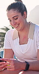 Smile, phone and typing with woman on tennis court for contact, tournament update and fitness. Online game fixture, communication and sports tips with person outdoor for training club and challenge