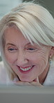 Woman, smile and reading in office with computer, digital report or good news for budget management. Happy, mature person or manager in business with desktop, cost control or financial planning goals