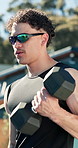 Weights, fitness and man outdoor for workout, muscle growth or body building in morning at house. Sports, equipment and person with dumbbells for arm exercise, wellness or active in backyard.
