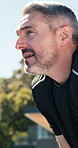 Fitness, sweating and man outdoor for exercise, relax or endurance training for challenge in morning. Wellness, break and mature person in backyard of home for workout, cardio or active on weekend.
