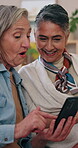 Mature, happy and lesbian couple on tablet in home for online browsing, social media or subscription. Women, talking and technology on living room sofa with surprise post on internet, network or app