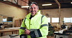 Face, inspection and man with clipboard in construction warehouse for building or planning. Manufacturing, portrait and mature person with checklist for workshop, safety or compliance for maintenance