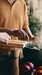 Hands, cooking and couple with pot in kitchen, bonding and ingredients for dinner or culinary skills. Meal prep, steam and mature people with vegetables, teamwork and mixing organic soup in house