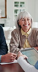 Nurse, tablet screen and talking with old couple in home for insurance meeting or sign up. Advice, consulting and healthcare with senior people speaking to caregiver for membership of medical policy