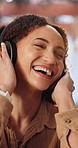 Dance, music and woman with headphones in home for good mood, streaming and movement on weekend. Happy, house and person laugh with rhythm, groove and listening to radio, album and track on break