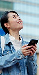Phone, walking and asian woman with smile in city for tourism, outdoor travel or sightseeing. Happy tourist, female person or exploring urban town with mobile smartphone for online guide or app