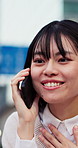 Surprise, chat and asian woman with phone call for good news, funny joke or humor in city. Shock, happy or female person with smile on smartphone for friendly conversation or discussion in urban town