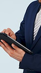 Hands, business and man in studio with tablet, research and schedule viewing for real estate. Space, male realtor and typing with digital, listing information and auction property on blue background