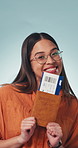 Face, woman and dance in studio with passport, visa approval and flight ticket for travel. Portrait, female person or excited with boarding pass, confirm booking and holiday abroad on blue background