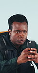 Photography, man and hiker with phone for travel memory, social media post and online vlog. Trekking, studio and black person with mobile for picture, status update and holiday on blue background