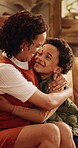 Hugging, laughing and mom with son in living room of home for bonding, love or security. African family, funny and smile with boy embracing excited woman in apartment for development or support