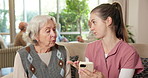 Old woman, caregiver and help with phone in home for medication reminder, online features or teach. Learning, senior person and carer explain for telehealth app, digital literacy and assisted living