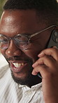 Black man, smile and phone call in home for communication, relax and social connection on weekend. Male person, happy and mobile conversation in living room for gossip, news and funny story in house