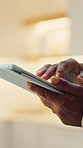 Hands, tablet and scroll in home for internet, reading news or blog post with online information. Technology, search and person with app to check article, newsletter or browsing website at house