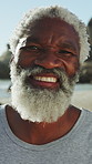 Holiday, face or senior man at beach with smile, positive attitude or upbeat on summer trip. Happy, portrait or black person at ocean with laugh, good mood or satisfaction on retirement vacation.