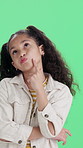 Child, girl and thinking with green screen for solution or problem solving on a studio background. Thoughtful, person or kid contemplating decision with choice, option or idea for question or answer