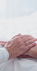 Holding hands, love and senior couple in hospital for empathy, care and bonding in marriage. Comfort, visit and elderly people with connection for trust, support or compassion at checkup in clinic.