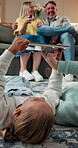 Gaming, tablet and floor with children in home for drawing app, support and bonding. Connection, digital sketching and online entertainment with parents and kids in living room of family house