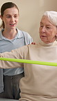 Physiotherapy, resistance band and health with old woman in clinic for consulting, stretching or fitness. Orthopedic, physical therapy and healing with patient in office for rehabilitation or support