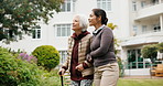 Caregiver, walking and old woman with cane at park, happy or healthcare service for  senior patient. Outdoor, nurse and support for elderly person with disability, bonding and together in nature