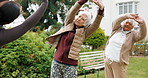 Woman, stretching and senior people outdoor for wellness, exercise and warm up for mobility. Retirement, garden and instructor with elderly group for fitness session, balance and movement for health