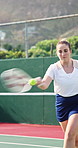 Tennis, hit and fitness with woman on court for challenge, competition practice and health. Strike, tournament and training with person and racket on outdoor sports club for hobby, match and game