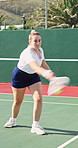 Tennis, strike and fitness with woman on court for challenge, competition practice and health. Hit, tournament and training with person and racket in outdoor sports club for hobby, match and game