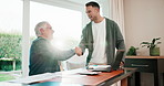 Father, handshake and adult son in home office with inheritance document, trust fund or finance deal. Flare, happy senior dad and men shaking hands for asset transfer, family business and investment.