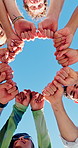 Happy, fist bump and circle of friends with blue sky for support, friendship and bonding on holiday. Below, huddle and men with women outdoor for solidarity, care and connection on weekend together