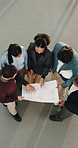 Architect, team and planning with blueprint for meeting, building strategy or layout together. Top view, people or group of contractors with floor design for property ideas or architecture project