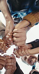 Below, flare and holding hands with people outdoor together for solidarity, support or unity. Sky, summer and team building with happy friends in circle for bonding, community wellness or connection
