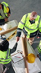 Architect, team and handshake on site with blueprint, design or engineer approval of building safety. Above, people and shaking hands for construction contract, floor plan validation and compliance.
