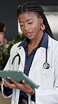 Doctor, tablet and online in hospital for medical information, records and telehealth app for advice. Female person, technology and scroll on internet for healthcare schedule, results and research