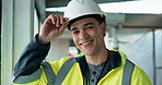 Construction, face or happy man on site with helmet, contractor or safety gear in building industry. Smile, confidence or engineer with ppe, handyman or compliance uniform in industrial development.