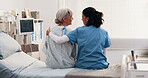 Medical, nurse and old person on hospital bed with hug, comforting and empathy for diagnosis. Back, elderly patient and doctor with consoling, understanding and sympathy for healthcare results.
