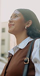 Thinking, reflection and businesswoman in city with ideas, memory or decision on finance career. Happy, planning and financial manager with choice on job opportunity in urban town from below.